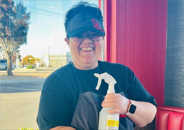 smiling arby's employee working their shift