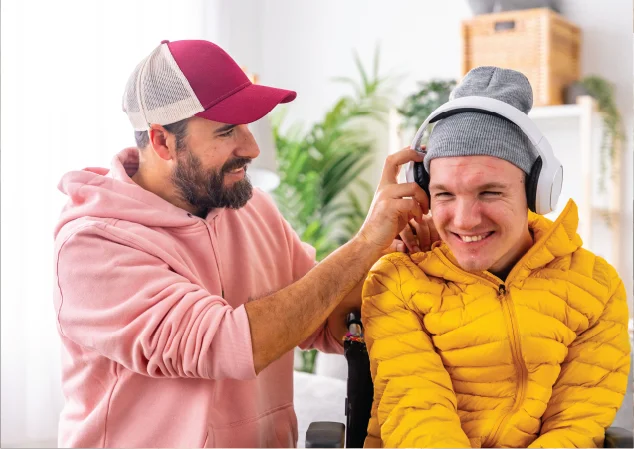 patient advocate placing headphones over patients' ears